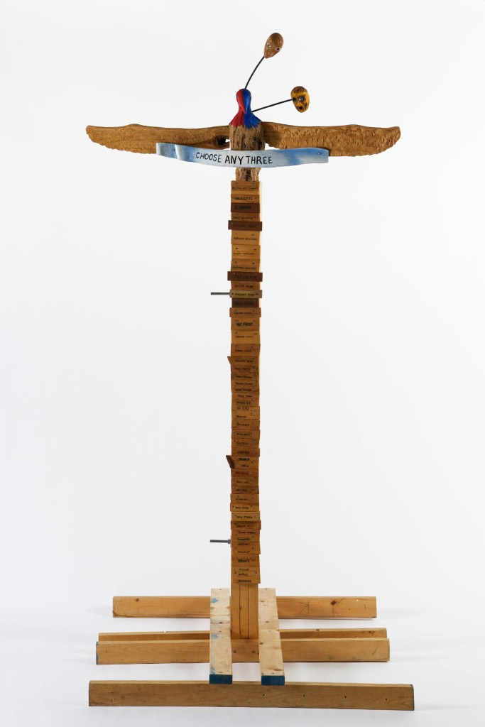 Jimmie Durham, Choose Any Three, 1989. Carved ash, magnolia, pine, metal, glass, acrylic paint. 99 ¼ × 49 ¼ × 48 in. (252 × 125 × 122 cm). Hammer Museum, Los Angeles. Purchased with partial funds provided by Susan Bay Nimoy and Leonard Nimoy. Image courtesy of kurimanzutto, Mexico City. 