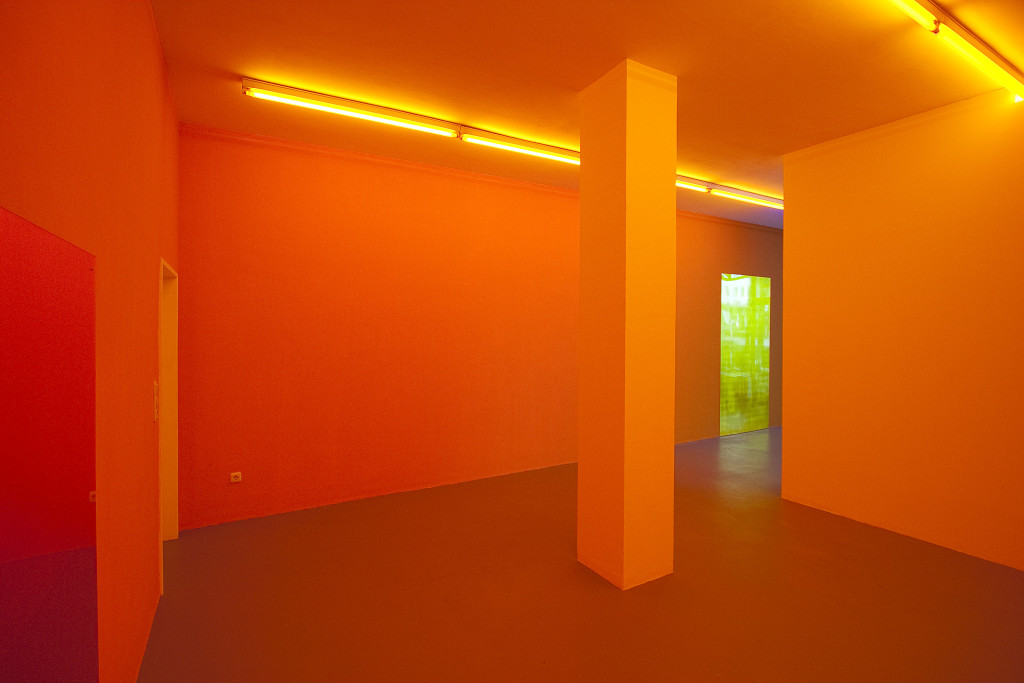 Gaylen Gerber, Kunstverein Ruhr, Essen, Germany, 2010. Installation view (left to right): latex paint, lighting gels, vinyl film, Gaylen Gerber, Support, n. d., Silver leaf, varnish on souvenir from Crossing Through the Colors, a work in situ, Daniel Buren (amber), 2006, 71.75 x 48 inches; Gaylen Gerber, Support, n. d., silver leaf, varnish on souvenir from Crossing Through the Colors, a work in situ, Daniel Buren (yellow), 2006, 94 x 48 inches. Photo: Gaylen Gerber.